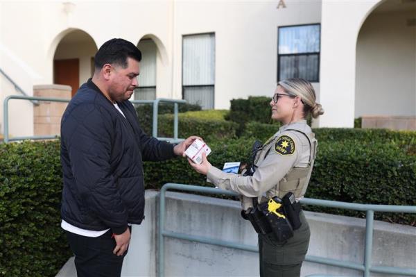 Deputy Giving Naloxone outside Sheriff